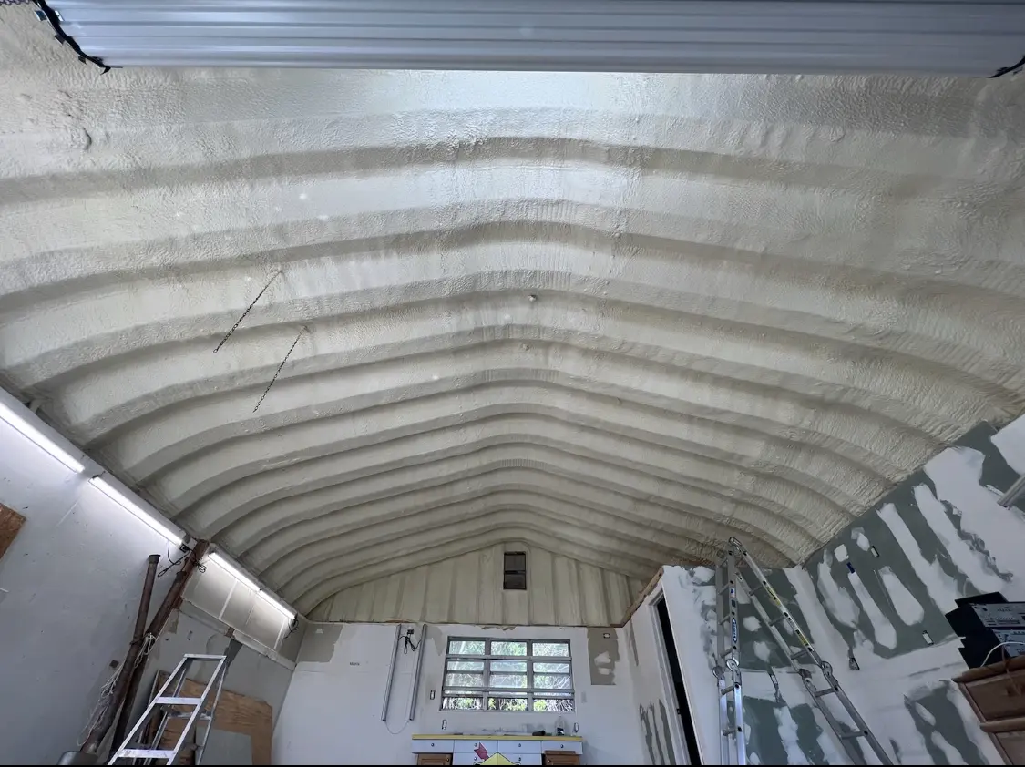 Spray polyurethane foam applied to the underside of a metal roof deck in Wagoner